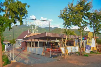 a shop with a sign on the front of it at Johnsons StopPoint in Zame
