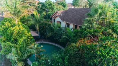 an aerial view of a house surrounded by trees at Villa Arumeru in Arusha