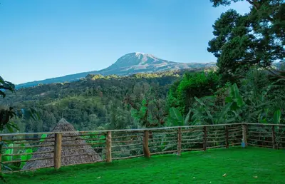 a view of a mountain from a fence at Materuni Homes in Moshi