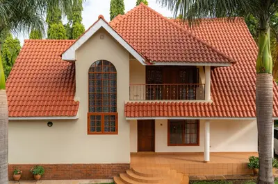a house with an orange roof at Kibo Homes Moshi in Moshi