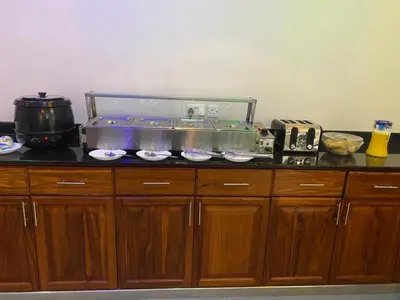 a kitchen counter with a fish tank on top of it at Medan Apartments in Arusha