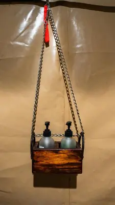 a chandelier with two bells hanging from a chain at Africa Safari South Serengeti Ndutu Ngorongoro in Sinoni