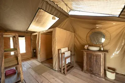 a tent with a mirror and a sink in it at Africa Safari South Serengeti Ndutu Ngorongoro in Sinoni