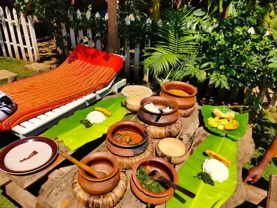a table topped with food and bowls of food at Arusha Jua Eco Home- on coffee farm in Arusha