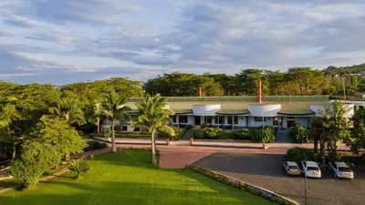 an aerial view of a building with cars parked in a driveway at Forest Hill Hotel in Arusha