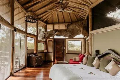 a bedroom with a large bed in a house at Tarangire Treetops in Monduli