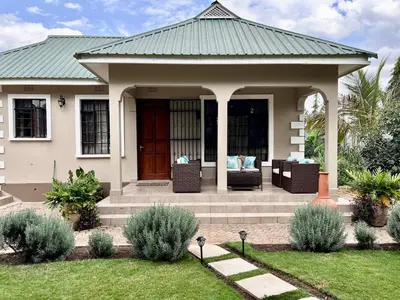 a house with a gazebo in a yard at The Angelique Oasis in Arusha