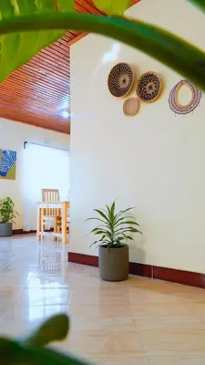 a room with a table and plates on the wall at Osotwa Maasai Hostel in Arusha