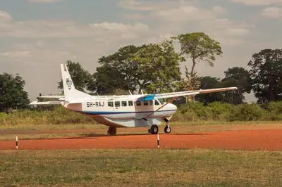 a small plane is sitting on a runway at Kili Seasons Hotel in Arusha