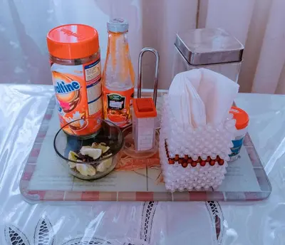 a tray with food and other items on a table at FARAJA HOMESTAY- Seamless Comfort in the Heart of the City - Free WiFi, Warm Hospitality, and Local Delights Await in Moshi