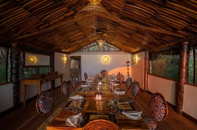 a long dining room with a long table and chairs at Kisima Ngeda Camp in Mangola