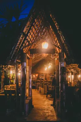 a man standing inside of a building at night at Kilimanjaro Scenic Homestay in Moshi