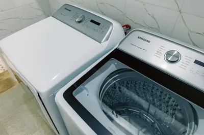 a white washer and dryer in a kitchen at Sarita Village Homes in Arusha