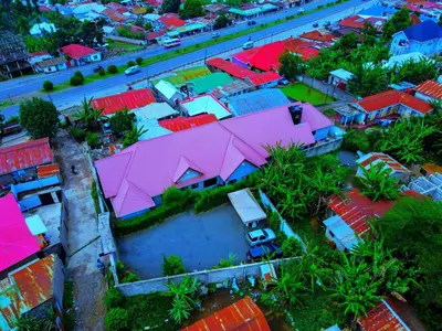 an overhead view of a house with colorful roofs at Safari Park House in Arusha