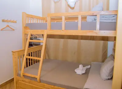 a bunk bed in a room with a bunk bed in a room at Tiny house with amazing view in Arusha