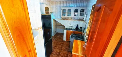 a small kitchen with a stove and a sink at Goodhope 3-Bedroom Vacation Rental in Arusha