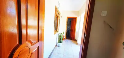 a hallway with a door and a potted plant at Goodhope 3-Bedroom Vacation Rental in Arusha