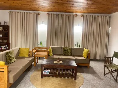 a living room with a couch and a coffee table at Toiwo Residence Arusha in Arusha