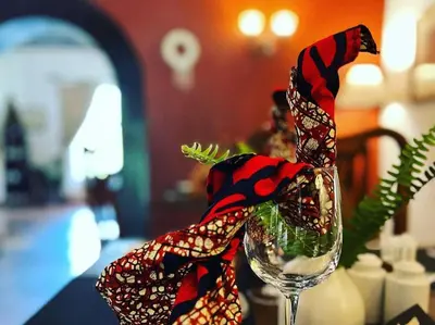 a wine glass with a scarf wrapped around it at Mount Meru Game Lodge in Arusha