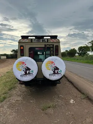 a bus parked on the side of a road at Safari villa in Arusha