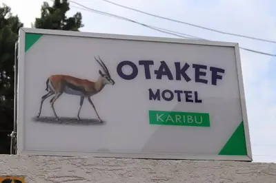 a sign for a camel motel with a deer on it at Otakef Motel in Arusha