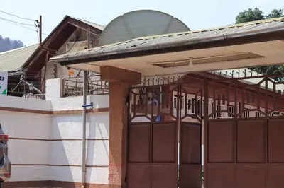 a building under construction with a metal gate at Otakef Motel in Arusha