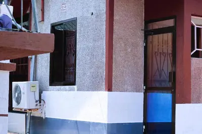 a building with a door and a window at Otakef Motel in Arusha